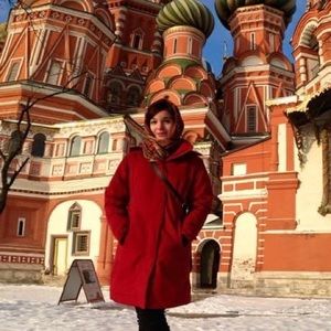 Marmot red parka, long with fur hood